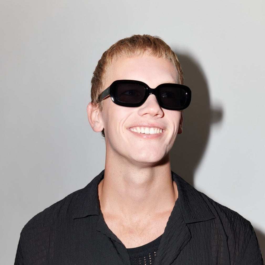 Szade - Soho sunglasses in black ink, vintage-inspired chunky oval and rectangular frame, worn by model.