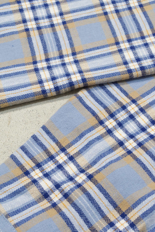 Blue plaid flannel shirt in classic Fjord style with blue, beige, and white check pattern.
