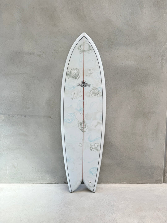 Michael Saggus 5’10 Fish surfboard with Oceania green/blue & white resin swirl and black pin lines.