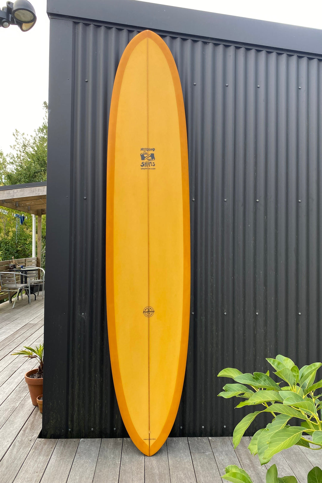 9'2" Mojo Pin surfboard with yellow gloss finish, designed by Mark O’Connor, featuring single concave and pintail for 2-5ft waves.