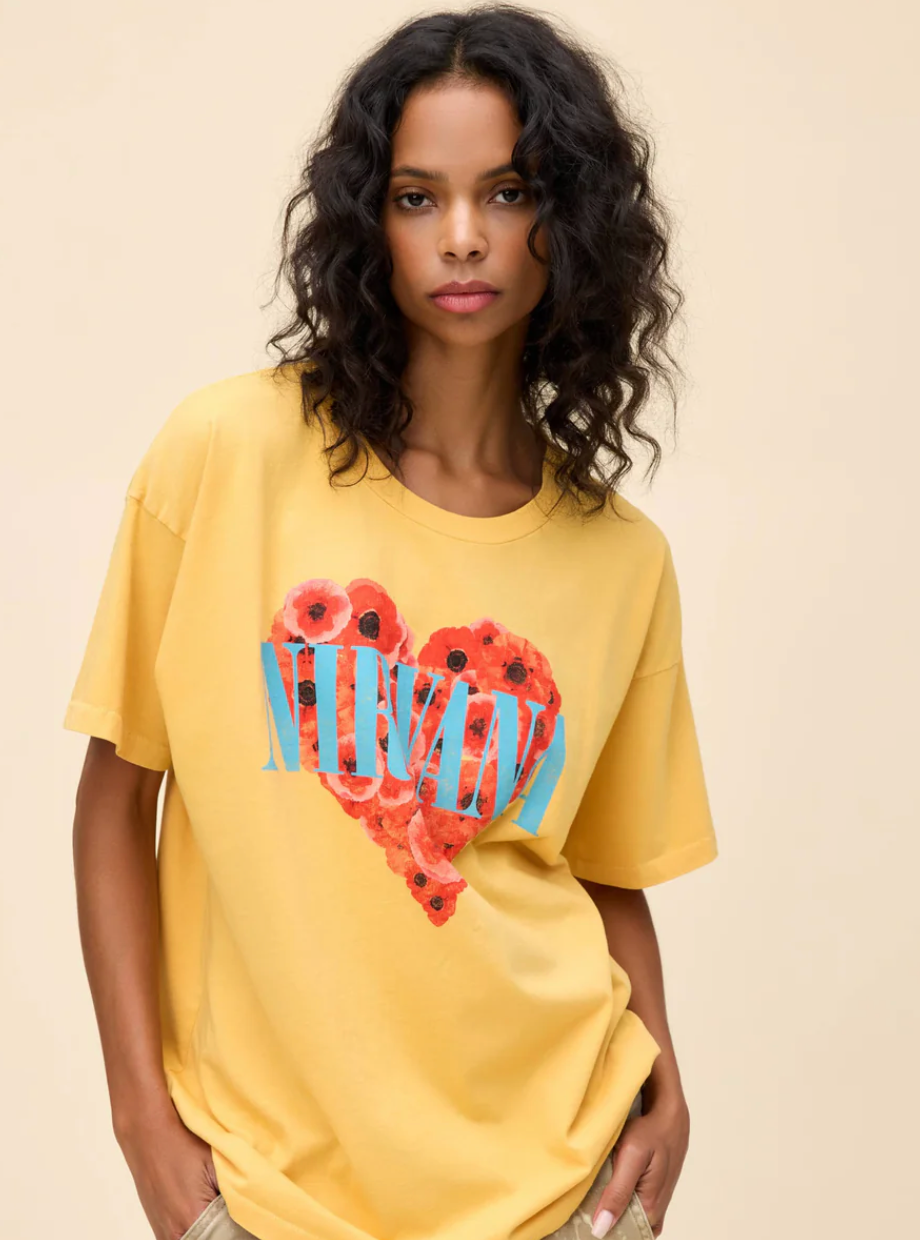 Nirvana vintage T-shirt with heart-shaped graphic and floral design.